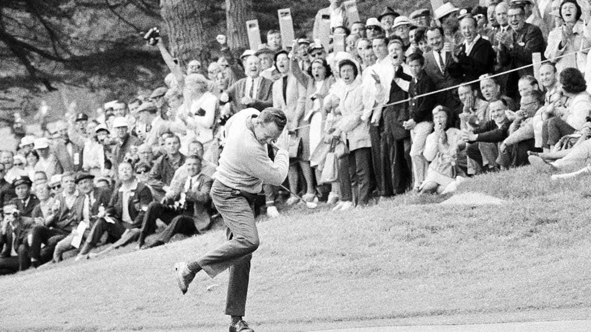 FILE - In this June 20, 1966, file photo, Billy Casper reacts after running a 25-foot putt into the cup on the 11th green during his playoff with Arnold Palmer for the U.S. Open title in San Francisco. Casper, a prolific winner on the PGA Tour whose career was never fully appreciated in the era of the 