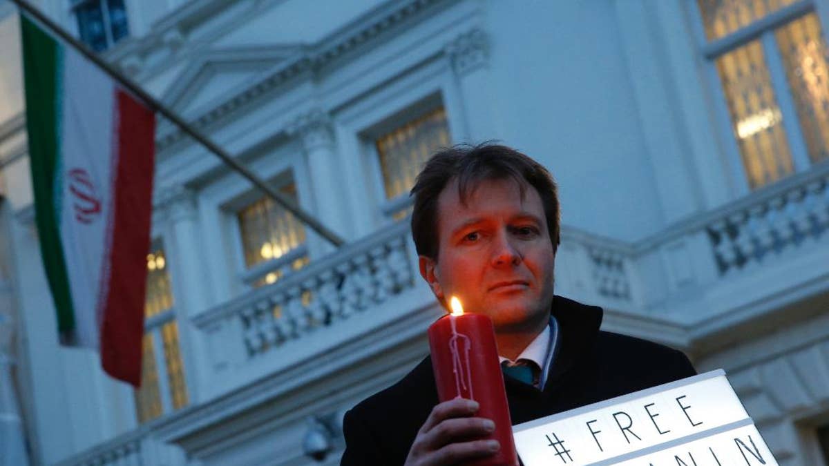 FILE -- In this Jan. 16, 2017 file photo, Richard Ratcliffe, husband of imprisoned charity worker Nazanin Zaghari-Ratcliffe, poses for the media during an Amnesty International led vigil outside the Iranian Embassy in London. The family of Zaghari-Ratcliffe who was detained in Iran while on a trip with her toddler daughter says all efforts to appeal her five-year prison sentence in court have failed. Ratcliffe, who works for the Thomson Reuters Foundation, the charitable arm of the news agency, found out this weekend that her appeal to Iran's supreme court failed. (AP Photo/Alastair Grant, File)
