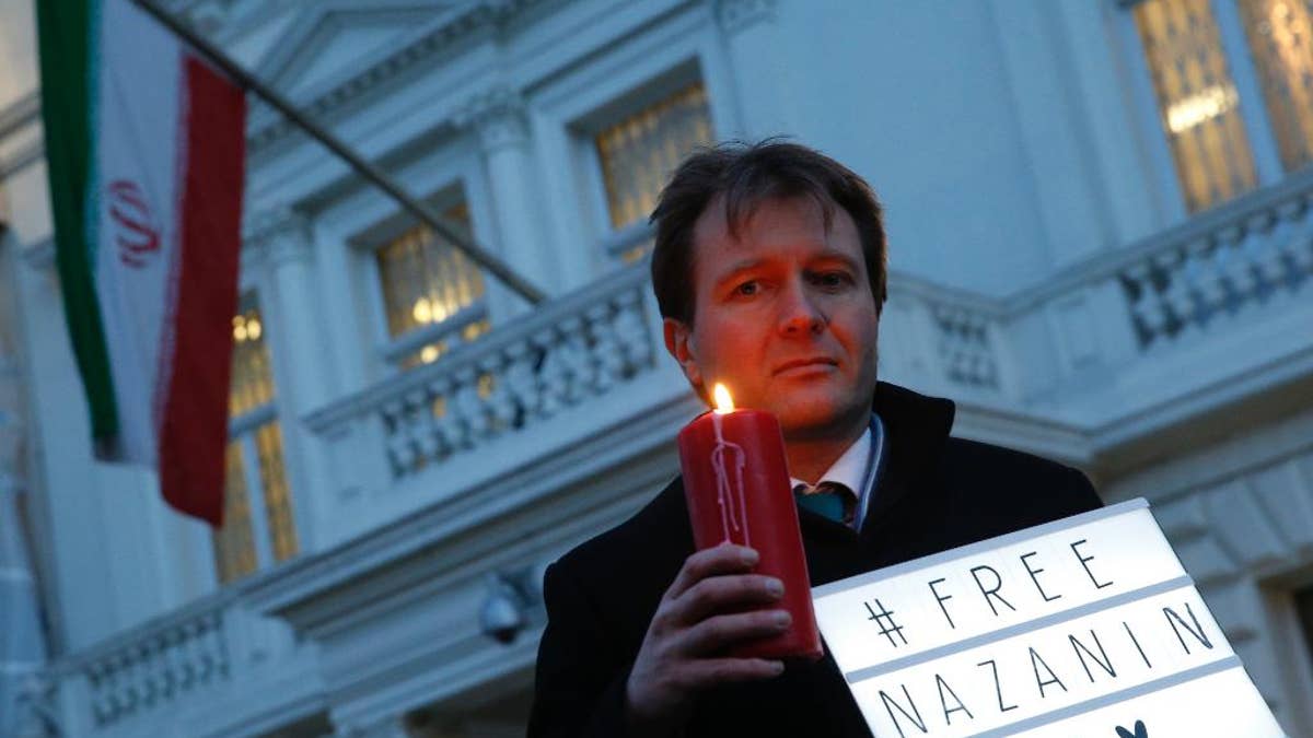 FILE -- In this Jan. 16, 2017 file photo, Richard Ratcliffe, husband of imprisoned charity worker Nazanin Zaghari-Ratcliffe, poses for the media during an Amnesty International led vigil outside the Iranian Embassy in London. The family of Zaghari-Ratcliffe who was detained in Iran while on a trip with her toddler daughter says all efforts to appeal her five-year prison sentence in court have failed. Ratcliffe, who works for the Thomson Reuters Foundation, the charitable arm of the news agency, found out this weekend that her appeal to Iran's supreme court failed. (AP Photo/Alastair Grant, File)