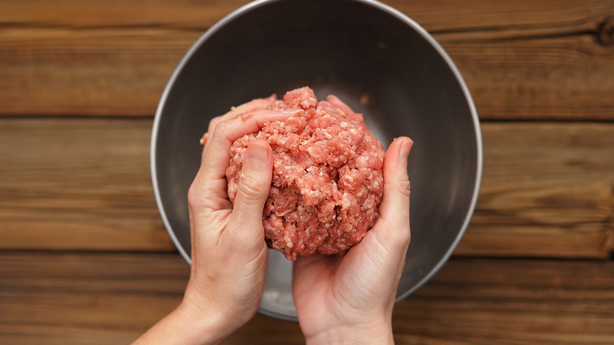 shaping beef patties istock