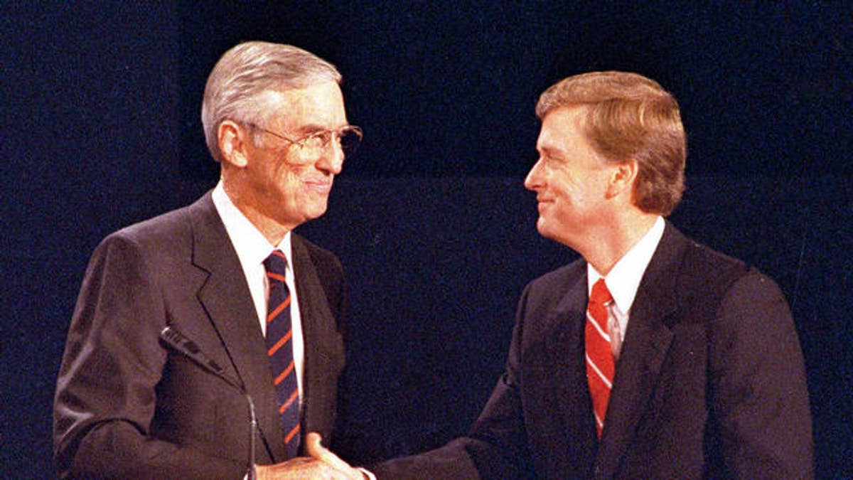Sen. Lloyd Bentsen, left, D-IN, and Sen. Dan Quayle, R-TX, shake hands after their vice presidential debate in Omaha, Neb., Oct. 5, 1988.  (AP Photo/Ron Edmonds)