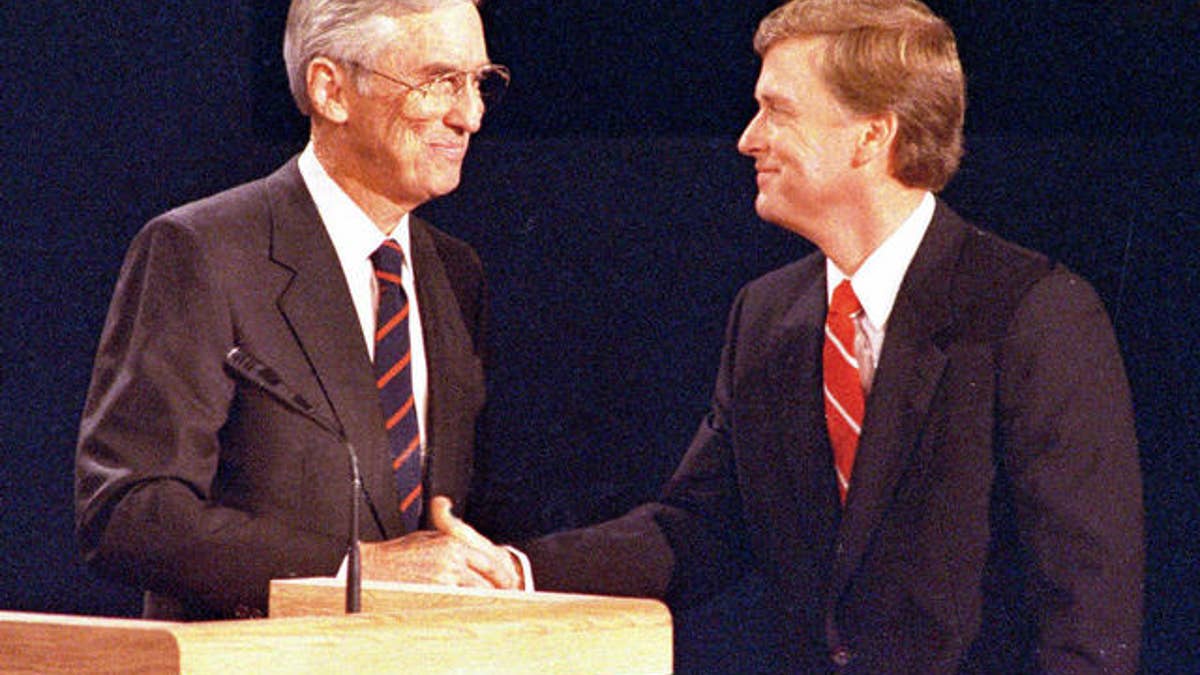 Sen. Lloyd Bentsen, left, D-IN, and Sen. Dan Quayle, R-TX, shake hands after their vice presidential debate in Omaha, Neb., Oct. 5, 1988.  (AP Photo/Ron Edmonds)