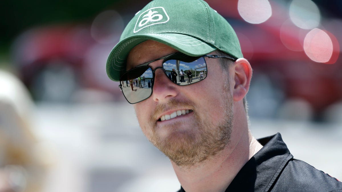 NASCAR driver Justin Allgaier looks on during a promotion for the DuPont Pioneer 250 NASCAR Nationwide Series auto race to be held in June at the Iowa Speedway, Monday, May 20, 2013, in Des Moines, Iowa. Allgaier is 4th in the Nationwide standings even though a win has eluded him so far in 2013. (AP Photo/Charlie Neibergall)