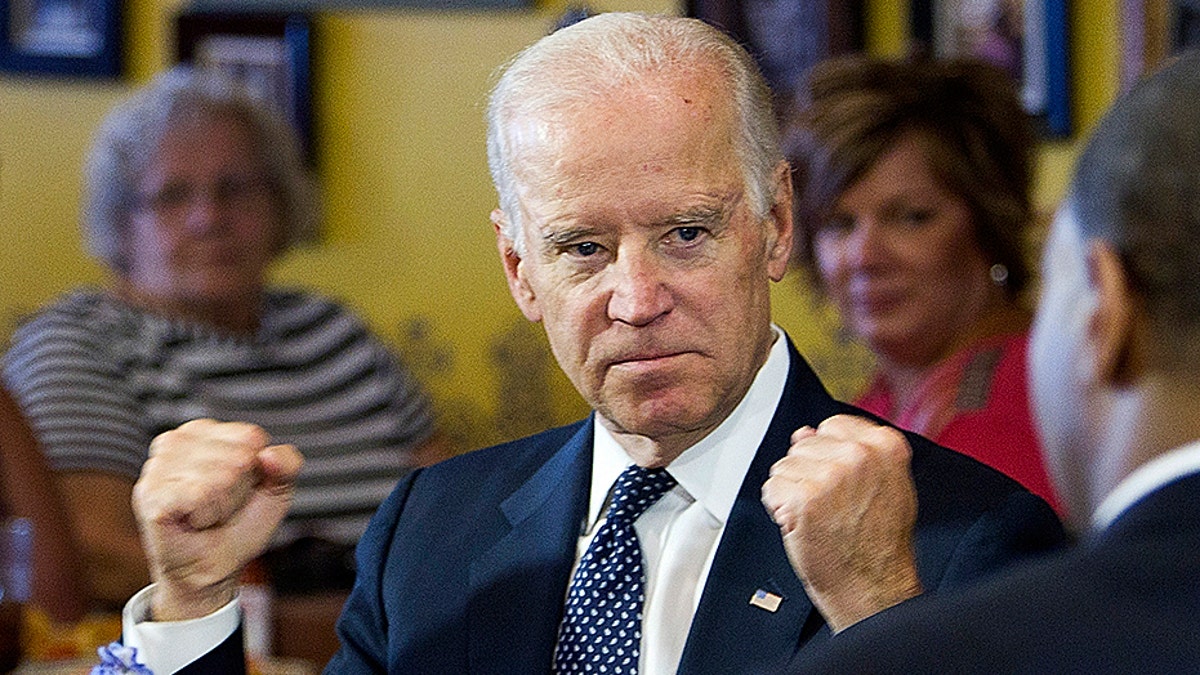 U.S. Vice President Joe Biden speaks with politicians and business owners in a round table discussion on raising the minimum wage at Casa Don Juan restaurant in Las Vegas, October 6, 2014. REUTERS/Las Vegas Sun/Steve Marcus (UNITED STATES - Tags: POLITICS BUSINESS EMPLOYMENT) - GM1EAA70IGE01