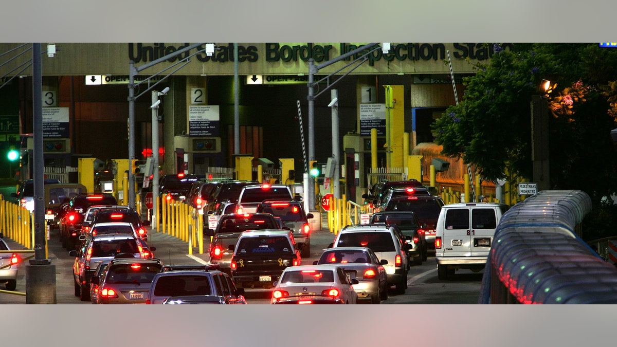 TIJUANA, MEXICO - OCTOBER 17: Cars wait in typically long lines to enter the United States from Mexico on the morning that the US population hit the historic milestone of 300 million on October 17, 2006 in Tijuana, Mexico. The 300 millionth American, clocked in at 7:46 am according to the US Census Bureau, could have been an immigrant crossing the border, a newborn, or someone entering the US by air. US population growth has been greatly fueled the influx and higher birth rate of Latinos and other immigrants in recent decades. This border crossing from Tijuana to San Ysidro, California is the worldis busiest border crossing. (Photo by David McNew/Getty Images)