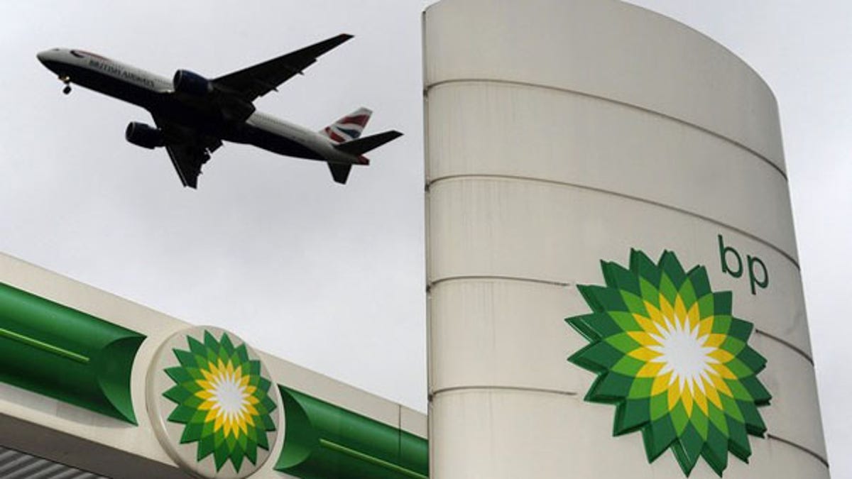 A plane flies over a British Petroleum gas station at Heathrow in London Feb. 2. (Reuters Photo)