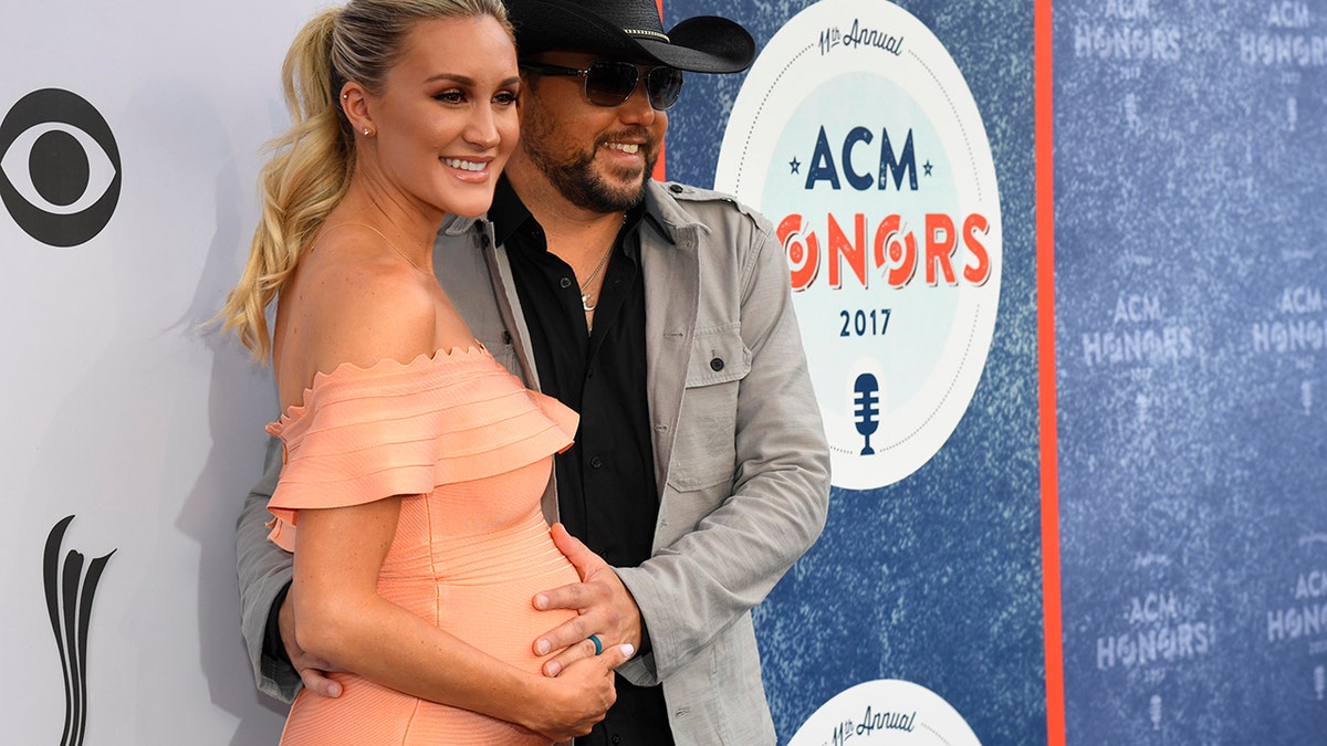 Jason Aldean and his wife Brittany Kerr arive at the 11th Annual ACM Honors in Nashville, Tennessee.