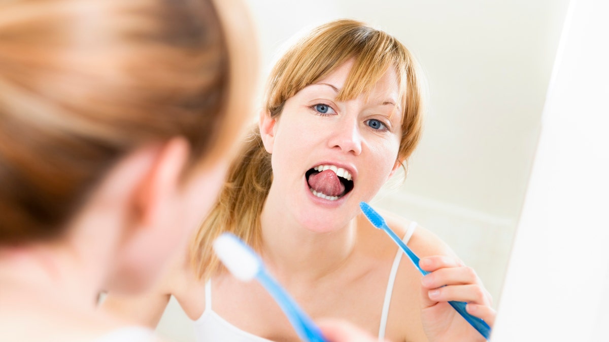 brushing teeth brushing tongue istock medium