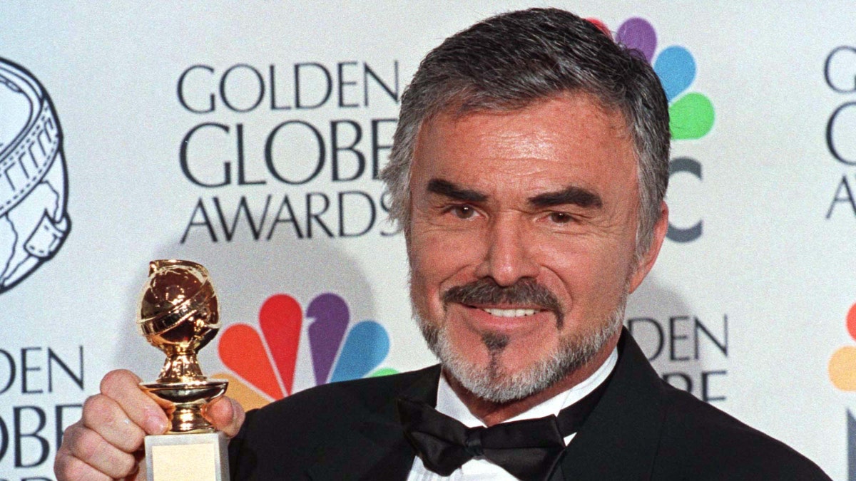 Burt Reynolds holds his Golden Globe award won for best supporting actor in a motion picture for "Boogie Nights" at the 55th annual Goden Globe Awards in Beverly Hills, January 18. The awards, sponsored by the Hollywood Foreign Press Association, honor excellence in film and television.

GOLDEN GLOBES - RTRALQK