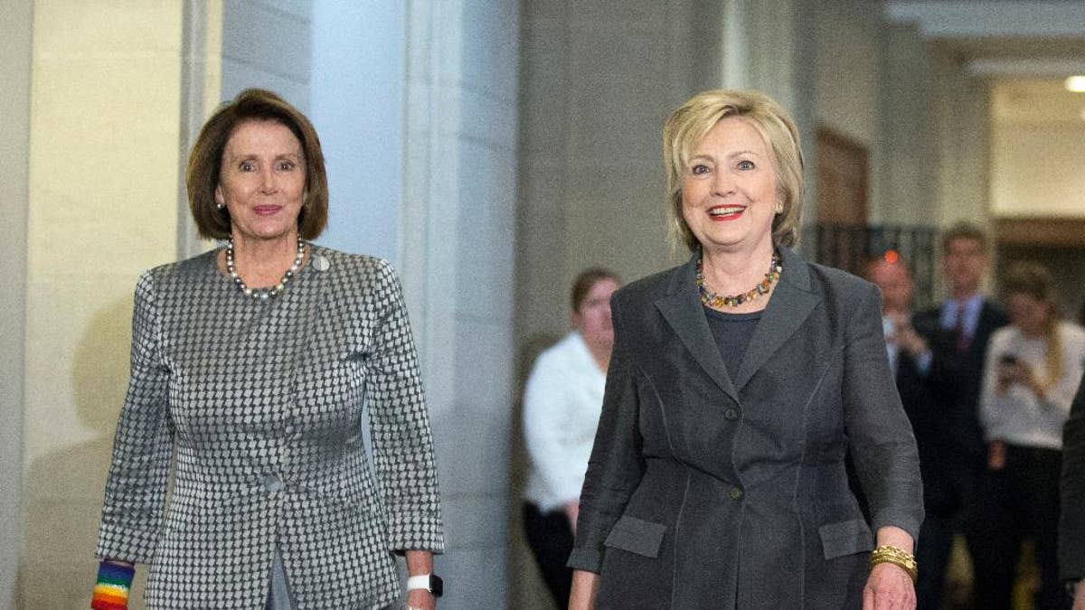 Democratic presidential candidate Hillary Clinton walks with House Minority Leader Nancy Pelosi of Calif. as they arrive for a meeting with the House Democratic Caucus, Wednesday, June 22, 2016, on Capitol Hill in Washington. (AP Photo/Alex Brandon)