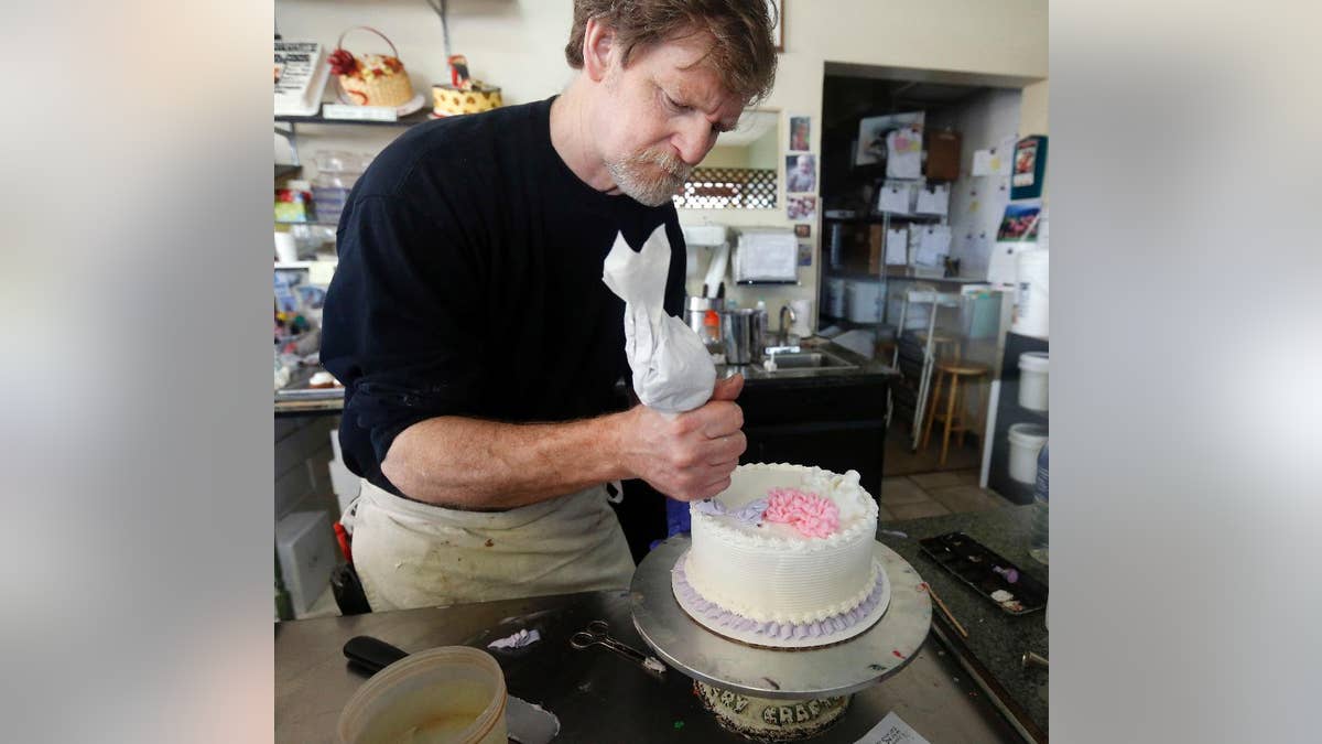 FILE - In this March 10, 2014, file photo, Masterpiece Cakeshop owner Jack Phillips decorates a cake inside his store in Lakewood, Colo. Colorado's Supreme Court has refused to take up the case of Phillips, who would not make a wedding cake for a same-sex couple, letting stand a lower court's ruling that the Masterpiece Cakeshop owner cannot cite his Christian beliefs in refusing service. The American Civil Liberties Union applauded the Monday, April 25, 2016 development, saying it affirmed that no one should be turned away from a business serving the public because of who they are or who they love. (AP Photo/Brennan Linsley, File)