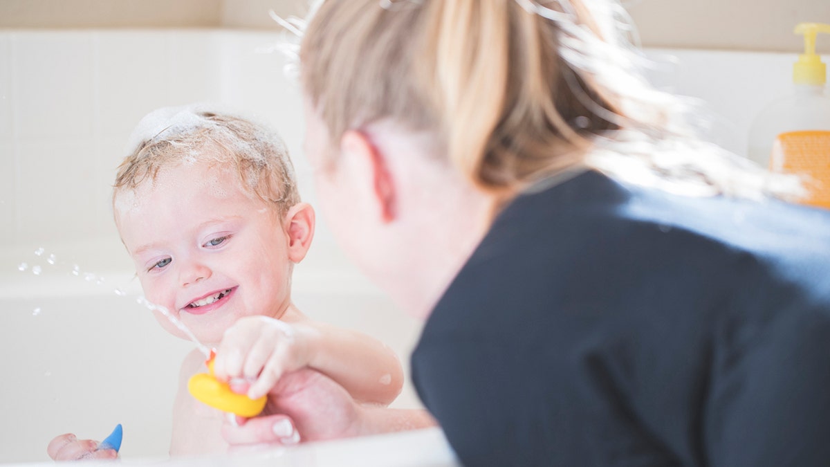 A stock photo of a 2 year old boy having a bath. Photographed using the Canon EOS 1DX Mark II