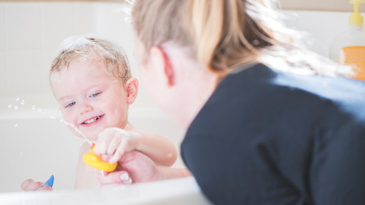 A stock photo of a 2 year old boy having a bath. Photographed using the Canon EOS 1DX Mark II