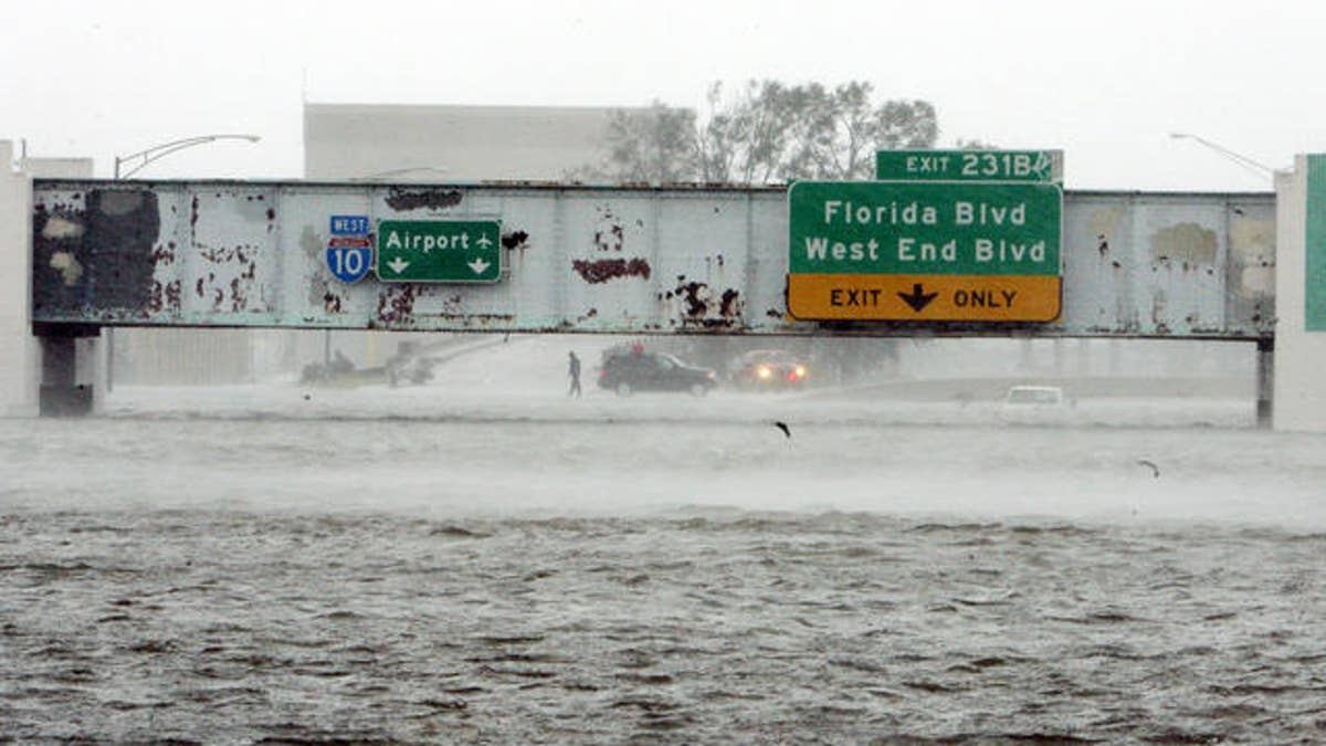 The Mound Underpass on Interstate-10 is flooded near downtown New Orleans on Monday, Aug. 29, 2005, as Hurricane Katrina dumped torrential rain and battered the city when it made landfall near Grand Isle. (AP Photo/Bill Haber)