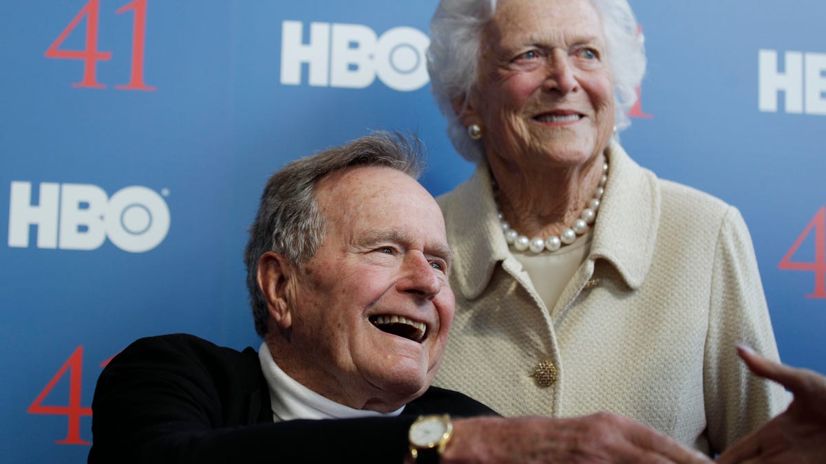 FILE - In a Tuesday, June 12, 2012 file photo, former President George H.W. Bush, and his wife, former first lady Barbara Bush, arrive for the premiere of HBO's new documentary on his life near the family compound in Kennebunkport, Maine. Bush spokesman Jim McGrath said Wednesday, Dec. 26. 2012 that doctors at the Houston hospital where Bush has been treated for a month remain cautiously optimistic that he will recover. Still, no discharge date has been set, and McGrath says that doctors are being cautious because at Bushs age sometimes issues crop up that are beyond anybodys ability to discern or foretell.(AP Photo/Charles Krupa, File) 