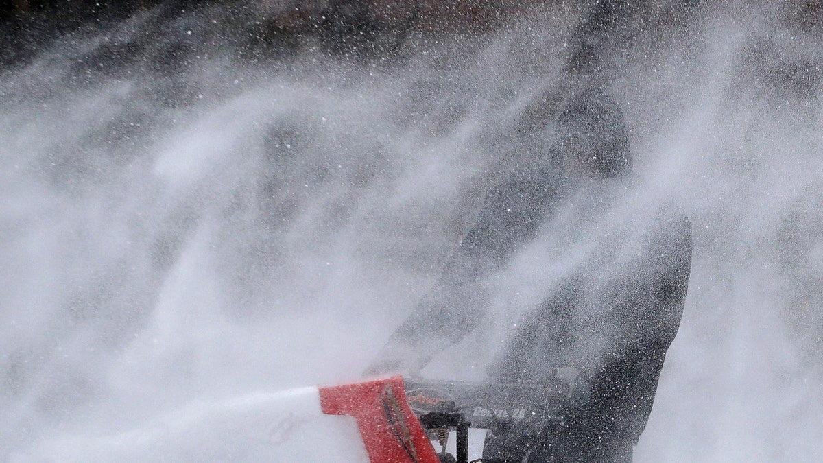 A popular snow blower is being recalled over a safety hazard as heavy winter storms have been blowing across much of the U.S. (AP Photo/Julie Jacobson)