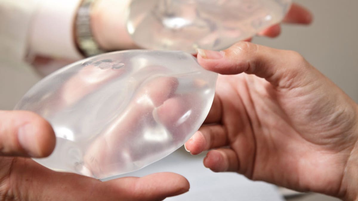 Woman's breast implant falls out of chest