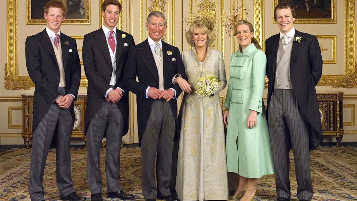 -GROUP PHOTO- Britain's Prince of Wales (centre L) and Duchess of Cornwall (centre R) are seen after their wedding with their children (L-R) Prince Harry, Prince William, Laura and Tom Parker Bowles, in the White Drawing Room at Windsor Castle in southern England, in this official photo from Clarence House released on April 10, 2005. ??? USE ONLY - PBEAHUOBFAQ