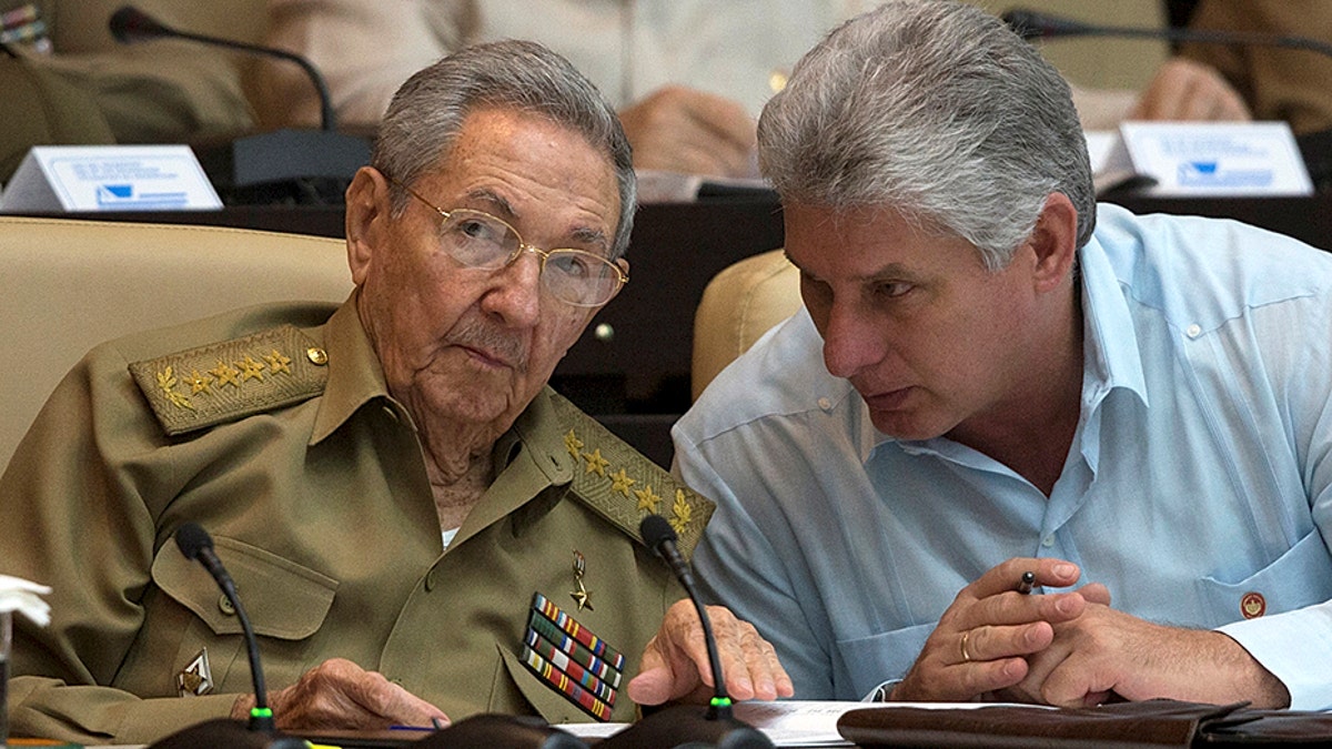 Cuba's President Raul Castro (L) chats with Cuba's Vice President Miguel Diaz-Canel react during the National Assembly in Havana, Cuba, July 8, 2016. Ismael Francisco/Courtesy of Cubadebate/Handout via Reuters. ATTENTION EDITORS - THIS PICTURE WAS PROVIDED BY A THIRD PARTY. FOR EDITORIAL USE ONLY. - S1BETONHQPAA