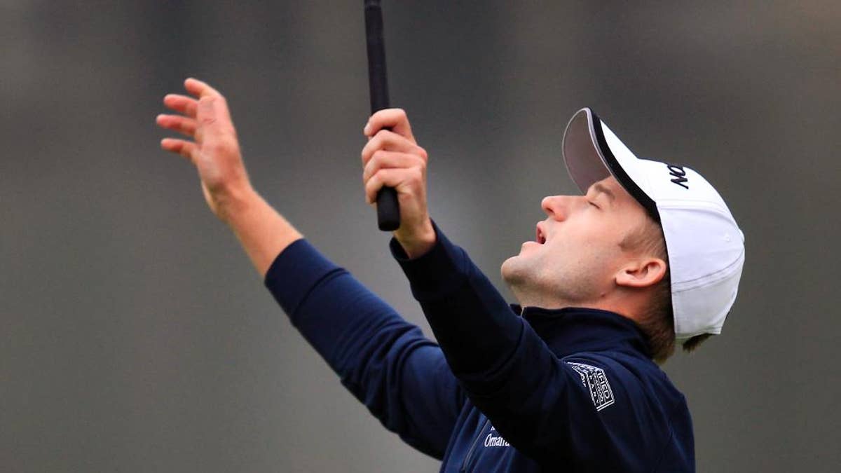 Russell Knox of Scotland celebrates on the 18th hole after the final round of the HSBC Champions golf tournament at the Sheshan International Golf Club in Shanghai, China Sunday, Nov. 8, 2015. (AP Photo)