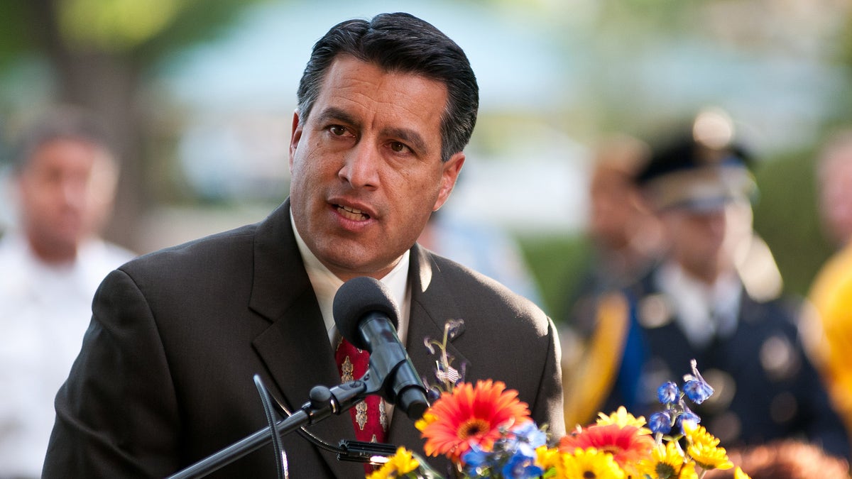 Nevada Gov. Brian Sandoval speaks during a memorial service for the victims of the Sept. 16, 2011, crash at the National Championship Air Races on Sunday, Sept. 25, 2011, in Reno, Nev. (AP Photo/Kevin Clifford)