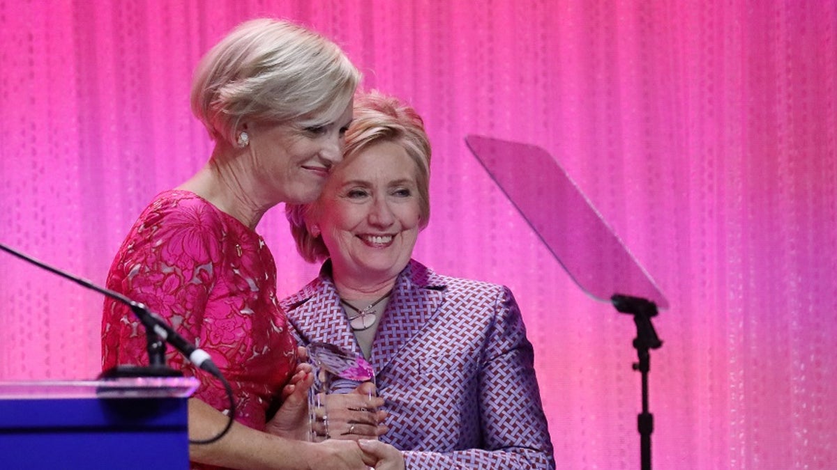 Former U.S. Secretary of State Hillary Clinton stands with Cecile Richards, president of Planned Parenthood Federation of America, during the Planned Parenthood 100 Years Gala in New York,U.S., May 2, 2017. REUTERS/Shannon Stapleton - RC1240C377C0