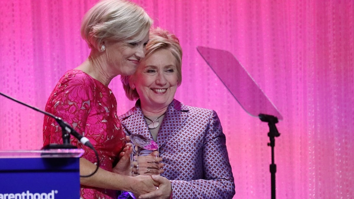 Former U.S. Secretary of State Hillary Clinton stands with Cecile Richards, president of Planned Parenthood Federation of America, during the Planned Parenthood 100 Years Gala in New York,U.S., May 2, 2017. REUTERS/Shannon Stapleton - RC1240C377C0