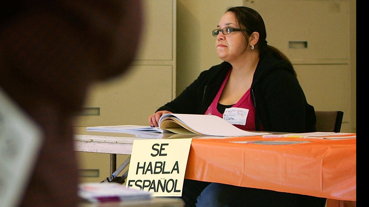 LOS ANGELES, CA - FEBRUARY 05: A sign reading, "Se habla Espanol", identifies a bilingual election official as voters go to the polls for Super Tuesday primaries in the predominantly Latino neighborhood of Boyle Heights on February 5, 2008 in Los Angeles, California. Latinos are an increasingly important factor in California where they are expected to account for 14 percent of the vote and tend to favor presidential hopeful Sen. Hillary Clinton (D-NY) over rival Sen. Barack Obama (D-IL). At 44 million, Latinos make up15 percent of the US population, the nation's largest minority group according to the latest Census Bureau estimates. (Photo by David McNew/Getty Images)