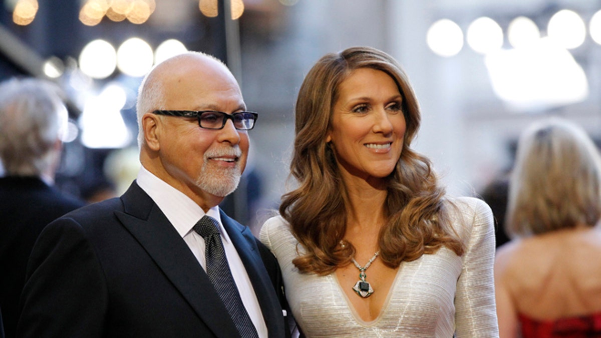 Singer Celine Dion and her husband Rene Angelil arrive at the 83rd Academy Awards at the 83rd Academy Awards in Hollywood, California, February 27, 2011.   REUTERS/Mario Anzuoni (UNITED STATES  - Tags: ENTERTAINMENT)  (OSCARS-ARRIVALS) - RTR2J81F