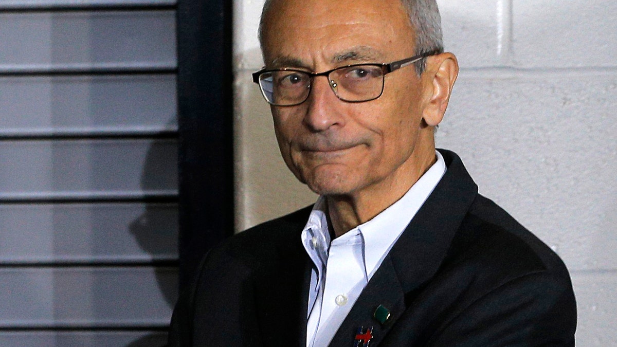 Campaign chairman John Podesta watches from the edge of the stage during a campaign rally with U.S. Democratic presidential nominee Hillary Clinton (not pictured) at Heinz Field in Pittsburgh, Pennsylvania, U.S. November 4, 2016. REUTERS/Brian Snyder - RTX2RYWJ