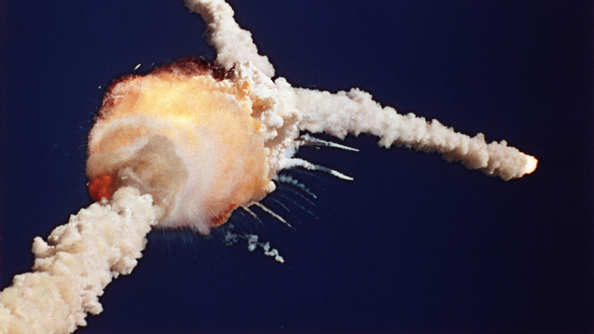 FILE - In this Jan. 28, 1986 file photo, the Space Shuttle Challenger explodes shortly after lifting off from Kennedy Space Center, in Fla. All seven crew members died in the explosion, which was blamed on faulty o-rings in the shuttle's booster rockets. Bob Ebeling had spent three decades filled with guilt over not stopping the explosion of Challenger, but found relief in the weeks before his death Monday, March 21, 2016, at age 89. NPR reports Ebeling had been a booster rocket engineer at a NASA contractor during the launch. He tried to convince them to postpone it, saying the cold temperatures could cause the shuttle to explode. (AP Photo/Bruce Weaver, File)