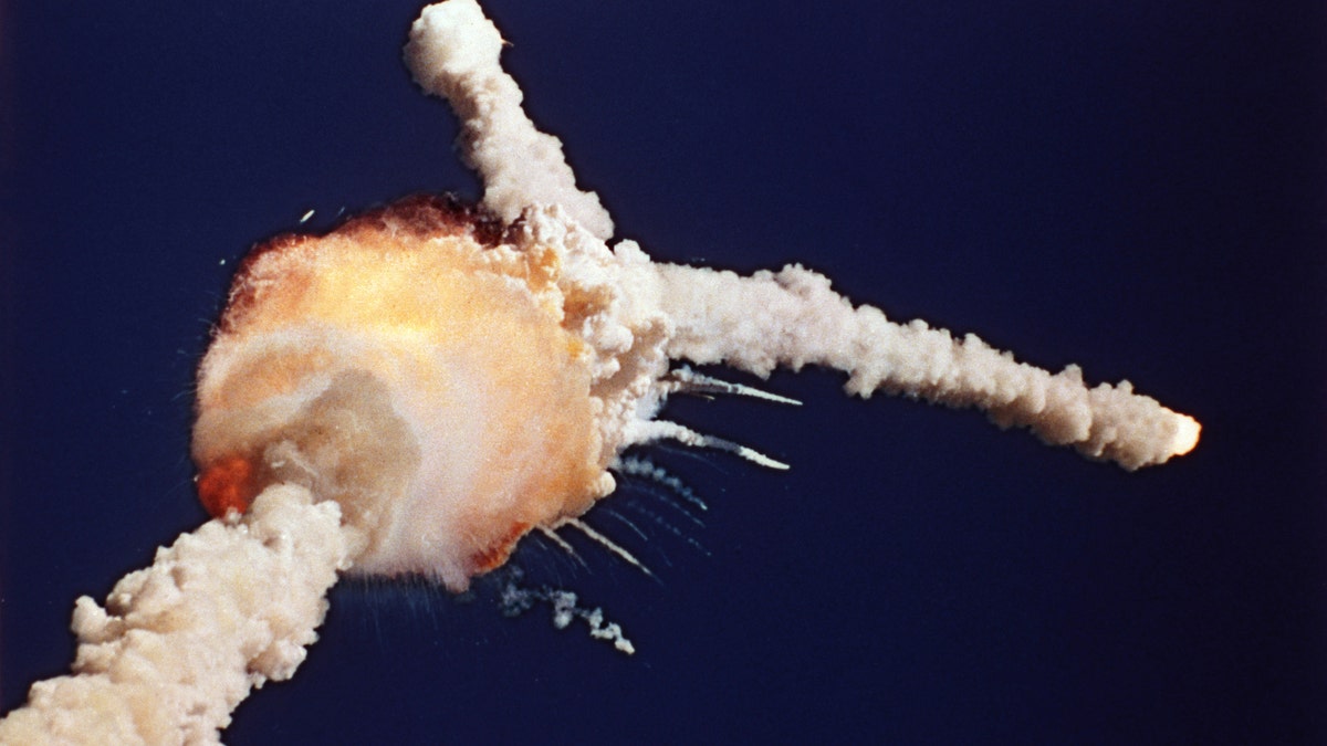 FILE - In this Jan. 28, 1986 file photo, the Space Shuttle Challenger explodes shortly after lifting off from Kennedy Space Center, in Fla. All seven crew members died in the explosion, which was blamed on faulty o-rings in the shuttle's booster rockets. Bob Ebeling had spent three decades filled with guilt over not stopping the explosion of Challenger, but found relief in the weeks before his death Monday, March 21, 2016, at age 89. NPR reports Ebeling had been a booster rocket engineer at a NASA contractor during the launch. He tried to convince them to postpone it, saying the cold temperatures could cause the shuttle to explode. (AP Photo/Bruce Weaver, File)