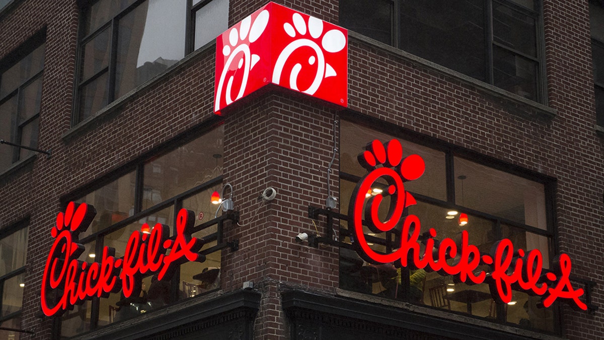 A franchise sign is seen above a Chick-fil-A freestanding restaurant after its grand opening in Midtown, New York October 3, 2015. REUTERS/Rashid Umar Abbasi - GF10000231061