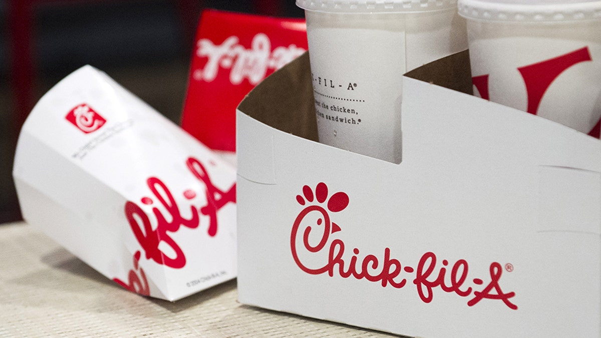 Drink and sandwich containers are seen on a customer's table during the grand opening of a Chick-fil-A freestanding franchise restaurant in Midtown, New York October 3, 2015. REUTERS/Rashid Umar Abbasi - GF10000231056