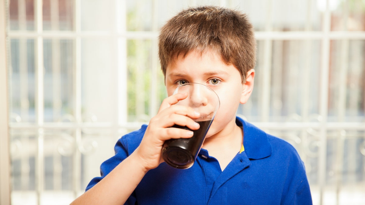 child drinking soda istock large