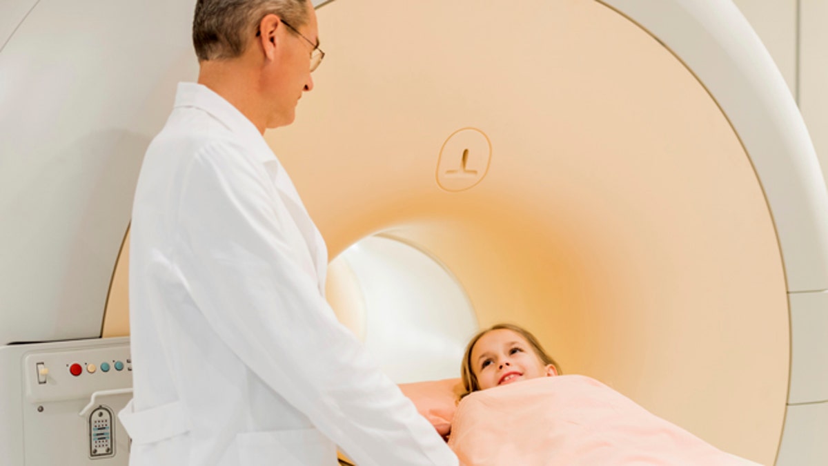 Radiologist talking to little girl.