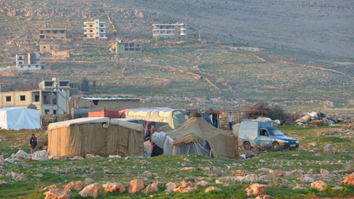 Syrian refugees in El Kaa village, closed to the Syrian bordernnnQaa or El Kaa  is a town in Lebanon. It is in the state/region of Baalbek-Hermel.nnFr. Andrzej Halemba trip Lebanon February 2013