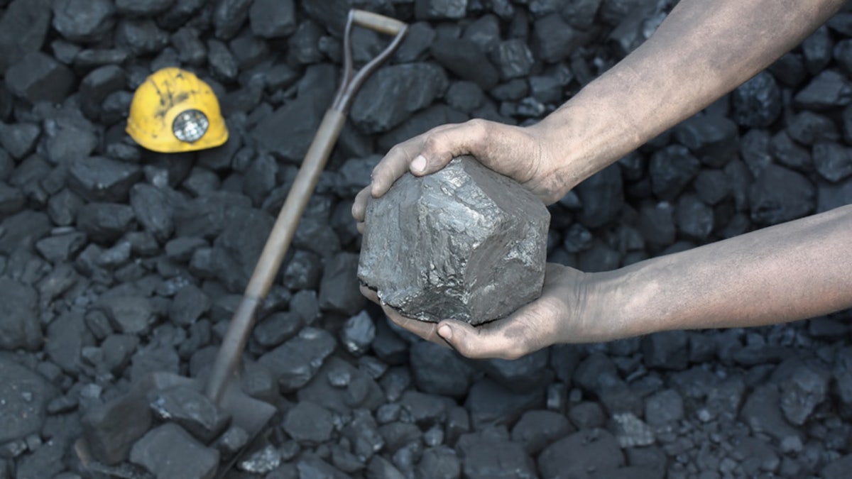 coal miner coal chunk istock