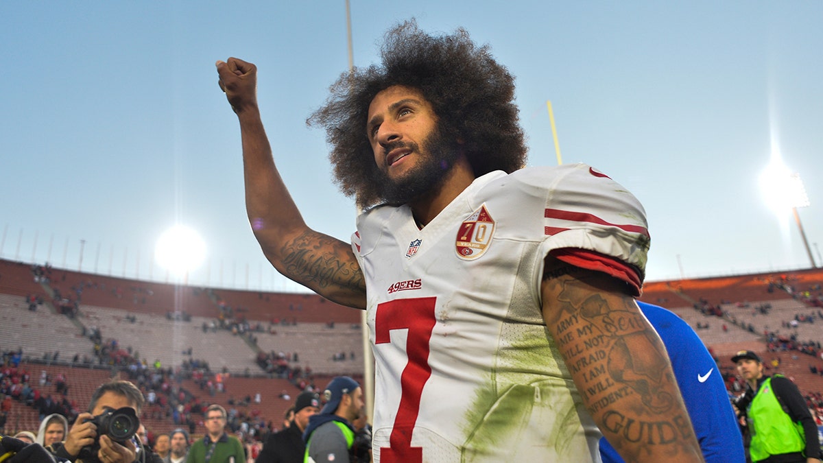Dec 24, 2016; Los Angeles, CA, USA; San Francisco 49ers quarterback Colin Kaepernick (7) pumps his fist as he acknowledges the cheers from the 49ers' fans after leading his team to a 22-21 come-from-behind win over the Los Angeles Rams at Los Angeles Memorial Coliseum. Mandatory Credit: Robert Hanashiro-USA TODAY Sports - 9767585