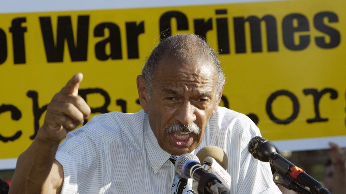 U.S. Representative John Conyers (D-MI) speaks at an anti-war rally near the White House in Washington, DC June 16, 2005, after delivering a petition to The White House signed by over 500,000 Americans and 94 members of U.S. Congress asking U.S. President George W. Bush to respond to questions raised by the 