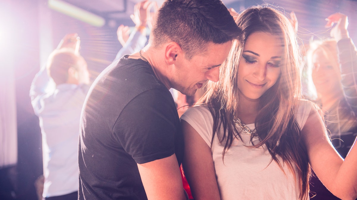 couple dancing at a nightclub istock