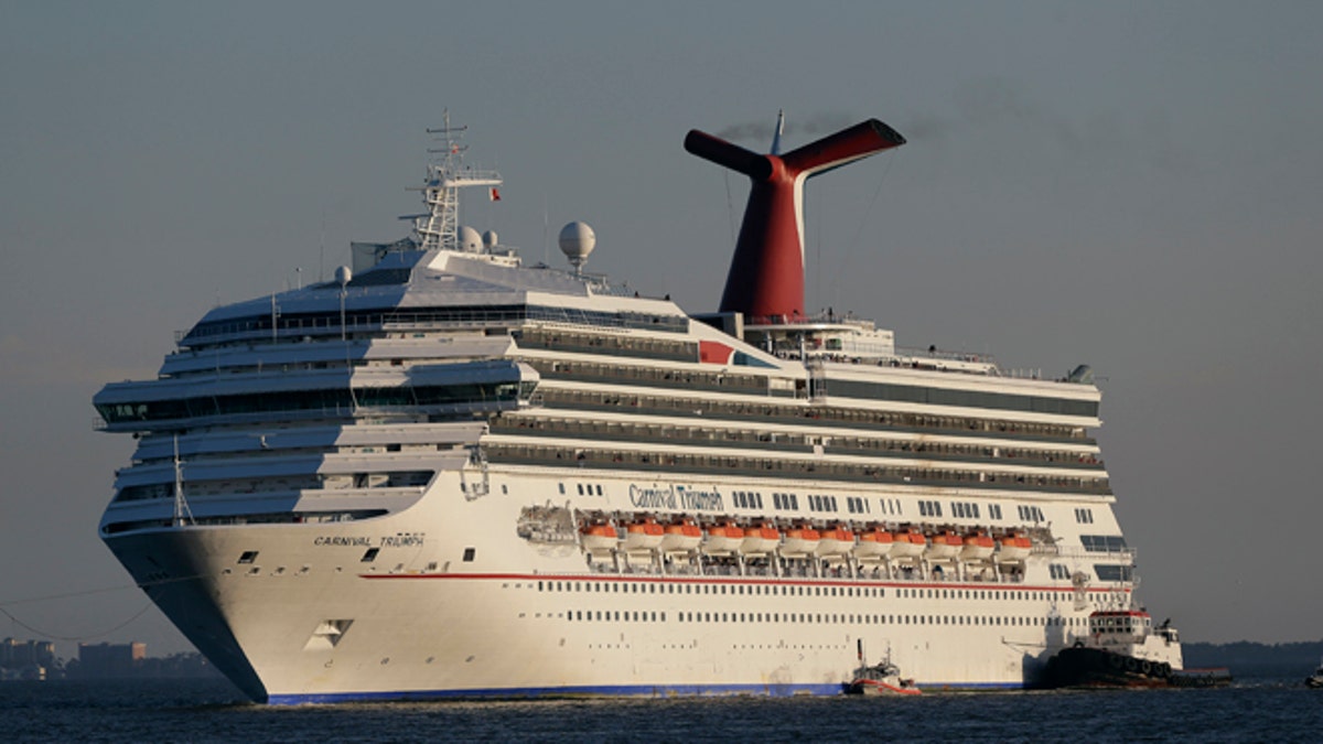 poop cruise vessel Carnival Triumph is towed into Mobile Bay adjacent Dauphin Island, Ala.