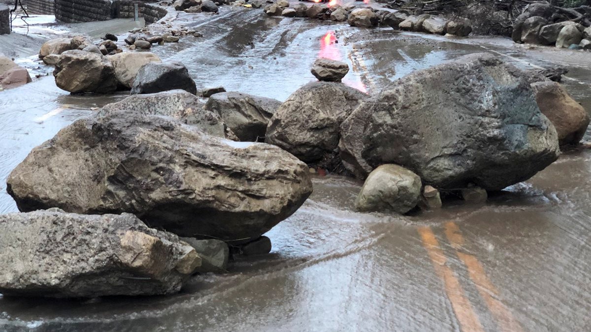 Boulders block a road after a mudslide in Montecito, California, U.S. in this photo provided by the Santa Barbara County Fire Department, January 9, 2018.   Mike Eliason/Santa Barbara County Fire Department/Handout via REUTERS     ATTENTION EDITORS - THIS IMAGE WAS PROVIDED BY A THIRD PARTY. - RC1933F11490