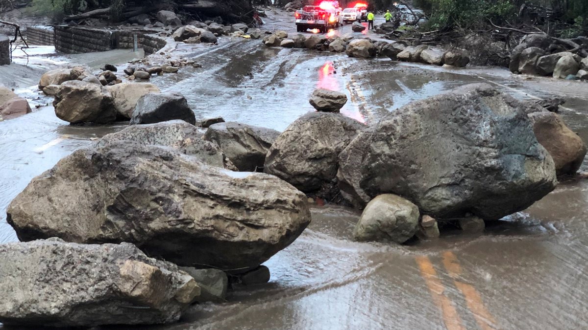 Boulders block a road after a mudslide in Montecito, California, U.S. in this photo provided by the Santa Barbara County Fire Department, January 9, 2018.   Mike Eliason/Santa Barbara County Fire Department/Handout via REUTERS     ATTENTION EDITORS - THIS IMAGE WAS PROVIDED BY A THIRD PARTY. - RC1933F11490