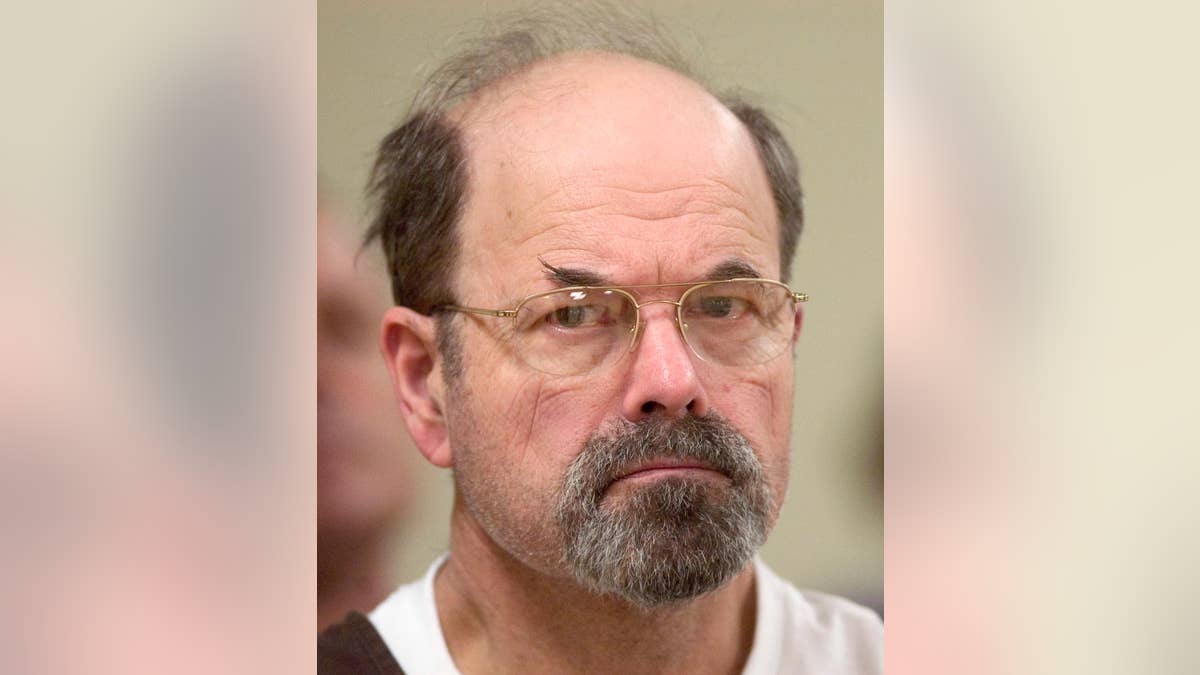 FILE - In this Oct. 12, 2005, file photo, convicted BTK killer Dennis Rader listens during a court proceeding in El Dorado, Kan. A new book says the BTK serial killer planned to kill an 11th victim by hanging her upside down in her Wichita, Kansas, home. It’s a story police heard from Dennis Rader himself in 2005, but decided at the time to suppress to protect the woman. The story was made public in “Confession of a Serial Killer: The Untold Story of Dennis Rader, the BTK Killer,” which has a scheduled release date of Sept. 6. (Travis Heying/The Wichita Eagle via AP, Pool)