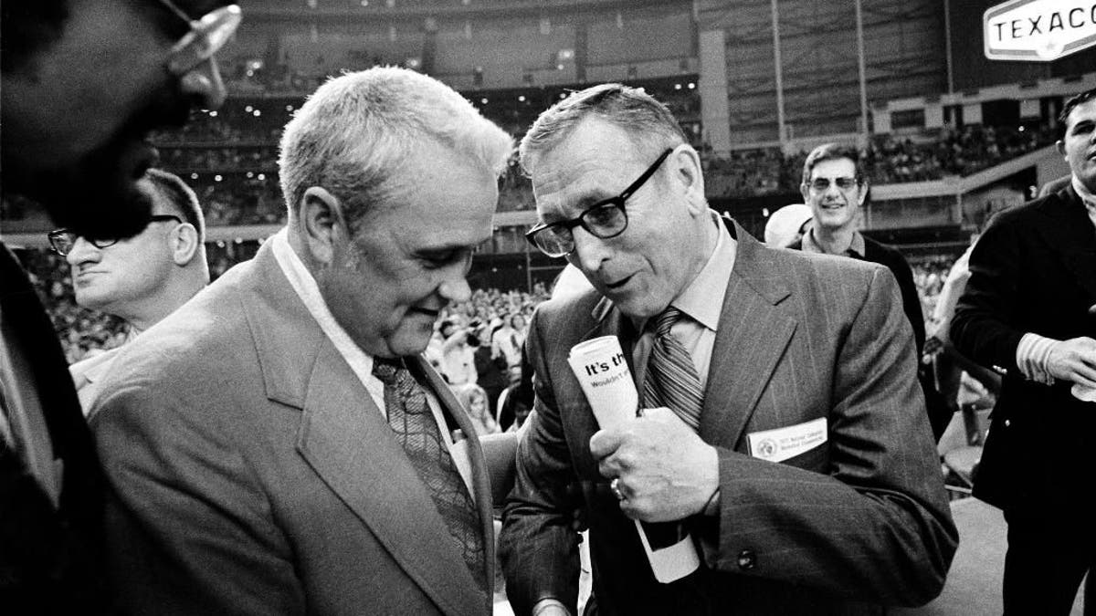 FILE - In this March 27, 1971, file photo, Villanova University basketball coach Jack Kraft, left, congratulates UCLA coach John Wooden after Wooden's Bruins defeated Villanova, 68-62, to win the NCAA championship in Houston, Texas. Villanova officials say former head basketball coach John 