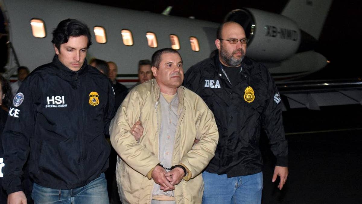 In this photo provided U.S. law enforcement, authorities escort Joaquin
