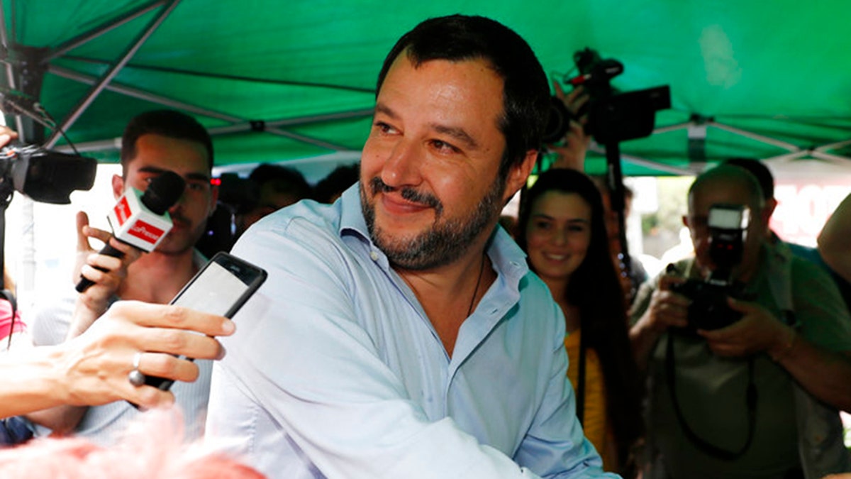 The League party leader Matteo Salvini votes on a program with the 5-Star Movement that could clear the way to Italy's first populist government, in Milan, Saturday, May 19, 2018. Leader of the 5-Star Movement Luigi Di Maio and League leader Matteo Salvini are to present their program and minister list, including a premier candidate, to Italian President Sergio Mattarella on Monday. (AP Photo/Antonio Calanni)