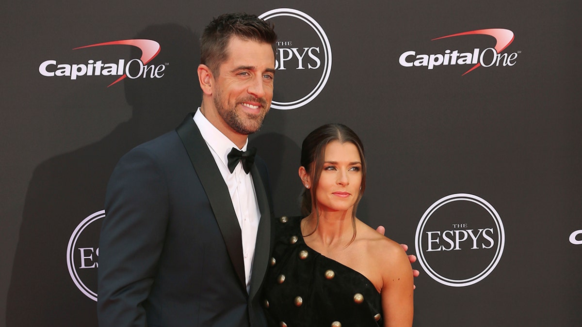 Green Bay Packers quartertback Aaron Rodgers, left, and host Danica Patrick arrive at the ESPY Awards at Microsoft Theater on Wednesday, July 18, 2018, in Los Angeles. (Photo by Willy Sanjuan/Invision/AP)
