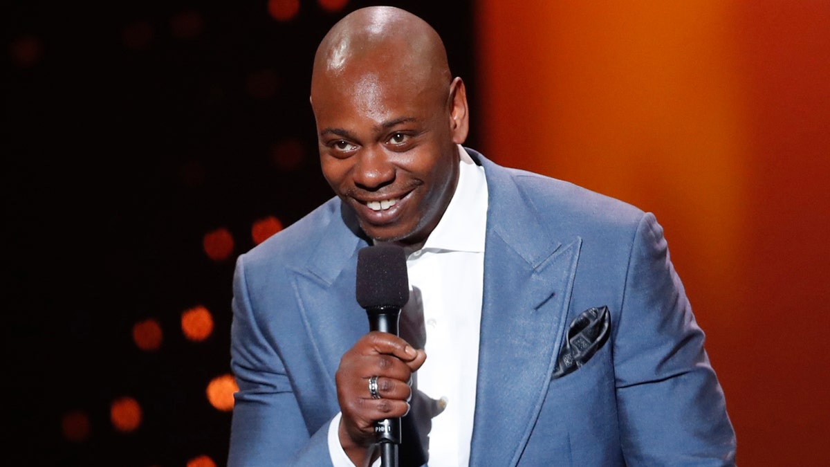 Dave Chappelle presents the ICON award to 